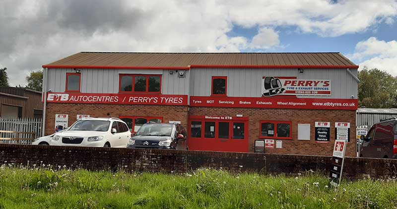 outside building of tyre centre with lights on