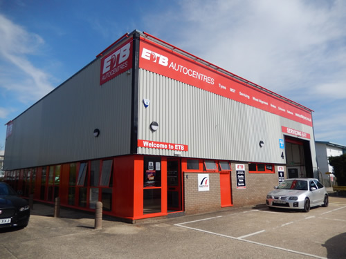 The staff outside building of tyre centre