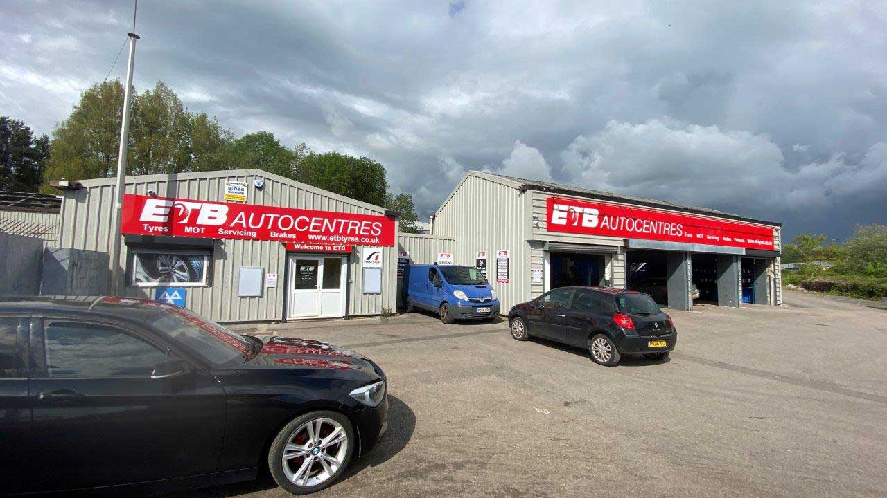 outside building of tyre centre with lights on