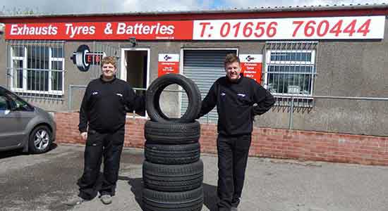 staff outside storefront of ETB Tyres Bridgendd